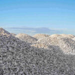 mounds of #57 crushed stone aggregate